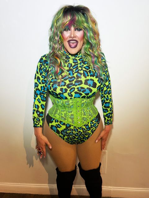 Abby Cummings in a neon green leopard bodysuit and corset