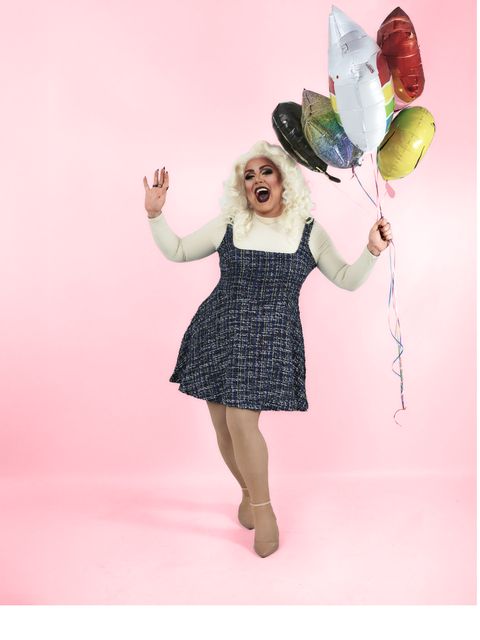 Abby Cummings kicking up a heel with a bunch of balloons