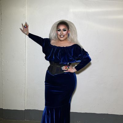 Abby in a navy velvet gown (opens Instagram)